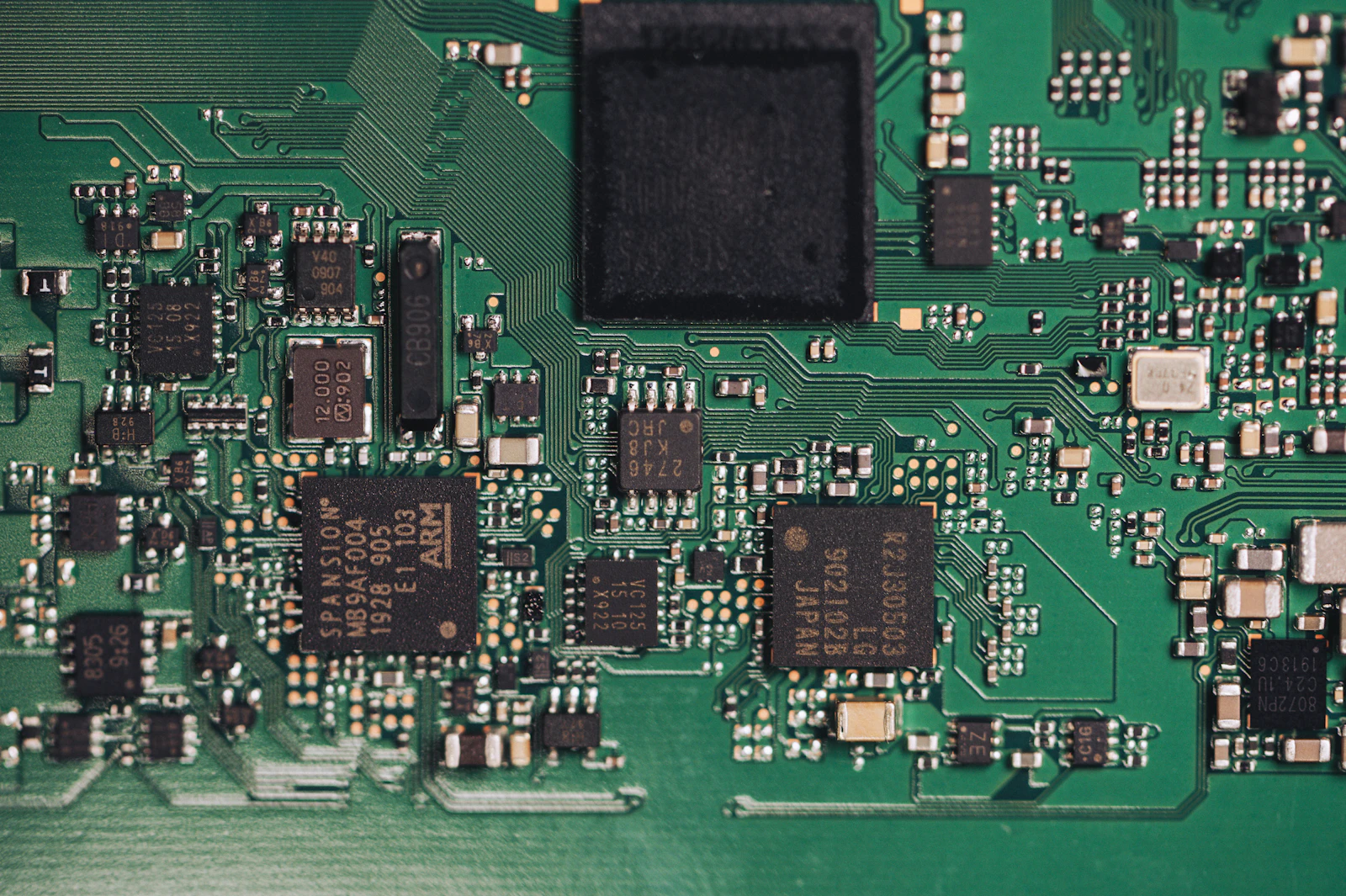Close detail of mounted components and solder joints on a printed circuit board